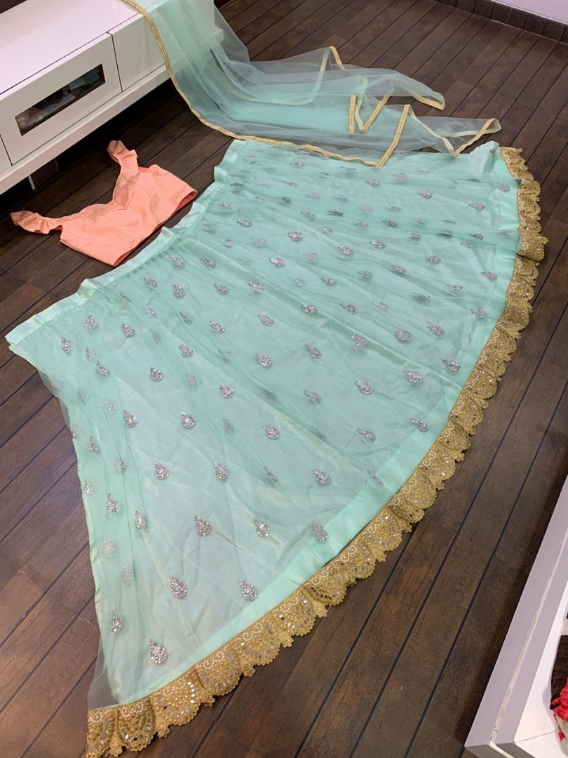 Pista green net embroidery work lehenga choli for ceremony