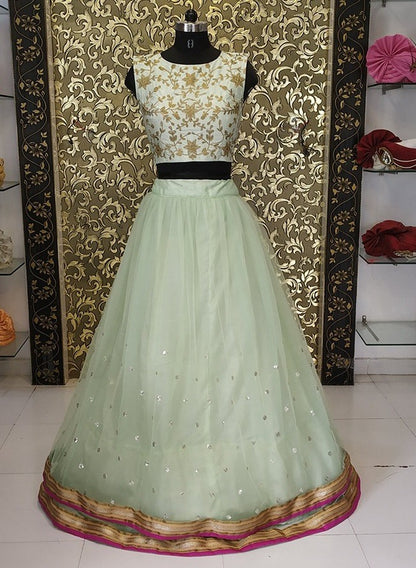 Pista green net sequence work lehenga with embroidered crop top