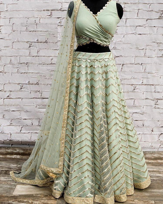 Pista green net sequence worked wedding lehenga choli