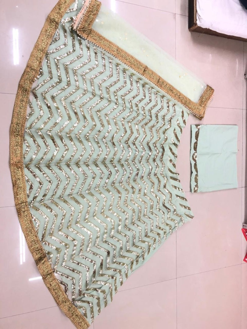 Pista green net sequence worked wedding lehenga choli