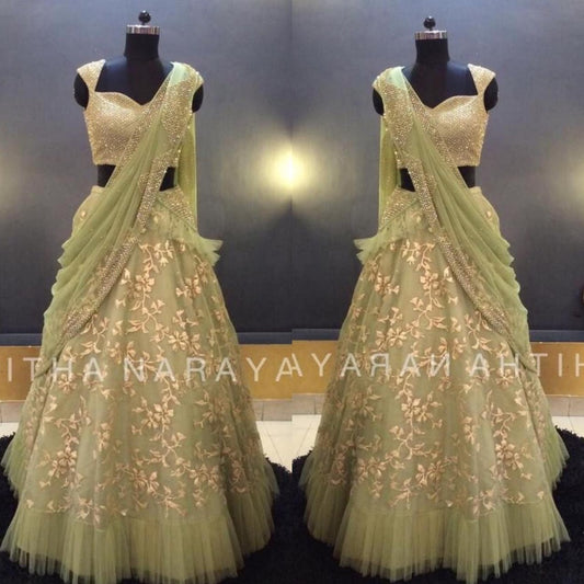 Pista green net thread zari work ruffle border wedding lehenga choli