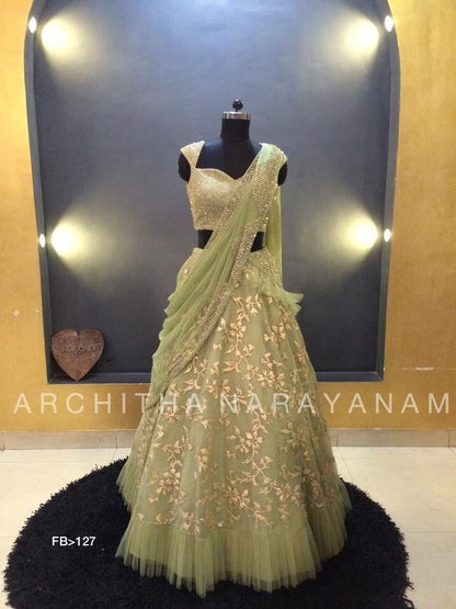 Pista green net thread zari work ruffle border wedding lehenga choli