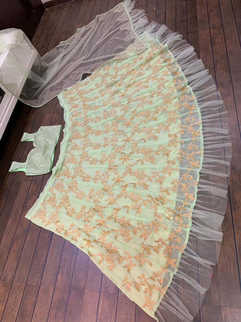Pista green net thread zari work ruffle border wedding lehenga choli