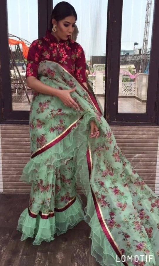 pista green printed georgette stylist ruffle saree