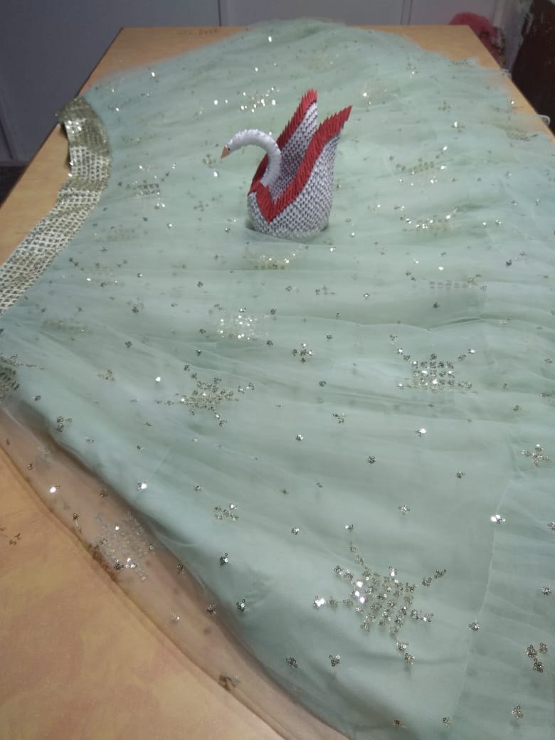 Pista green soft net beautiful worked lehenga choli for ceremony