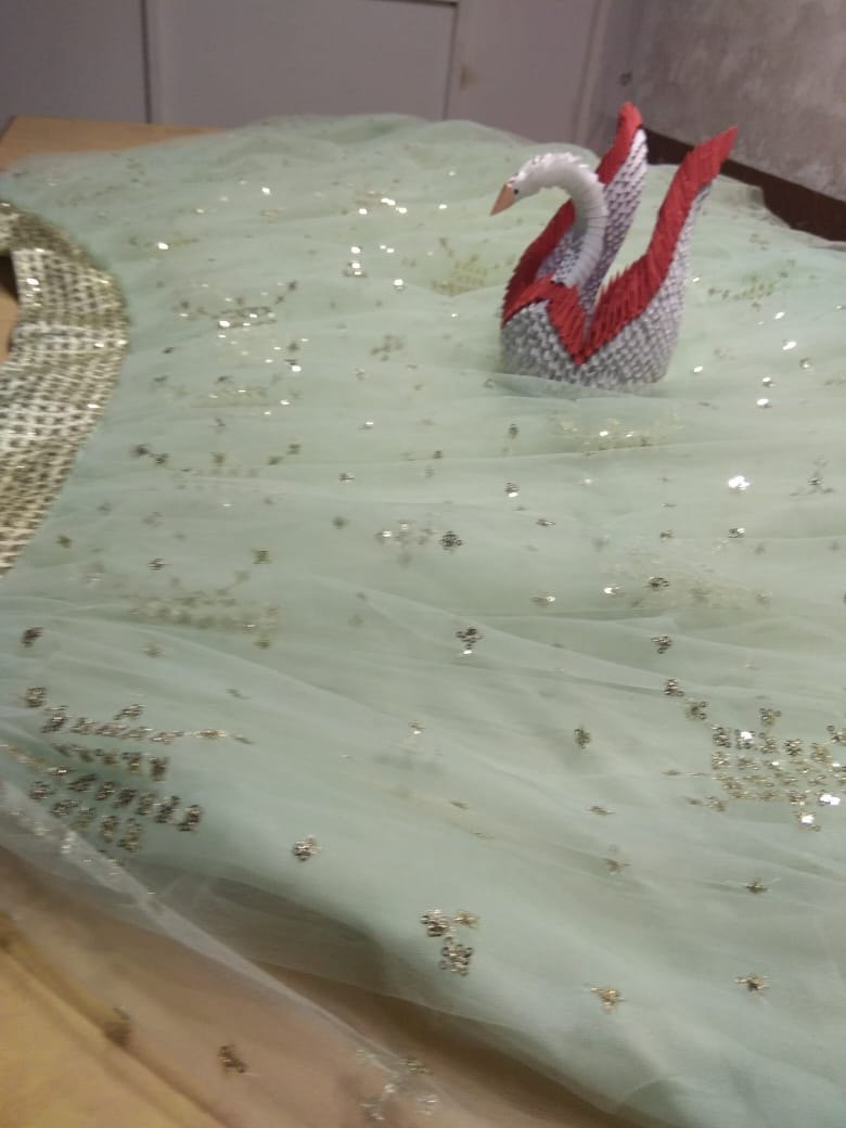 Pista green soft net beautiful worked lehenga choli for ceremony