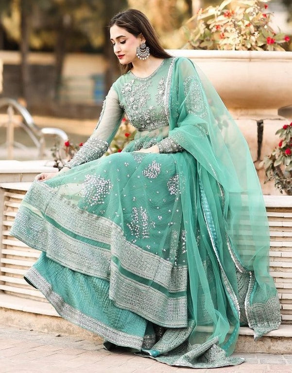 Pista green soft net embroidery worked wedding sharara suit