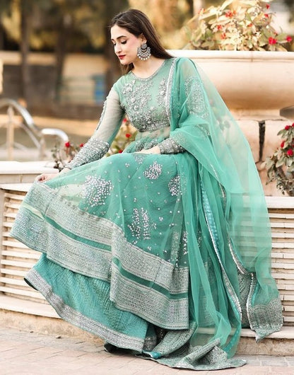 Pista green soft net embroidery worked wedding sharara suit