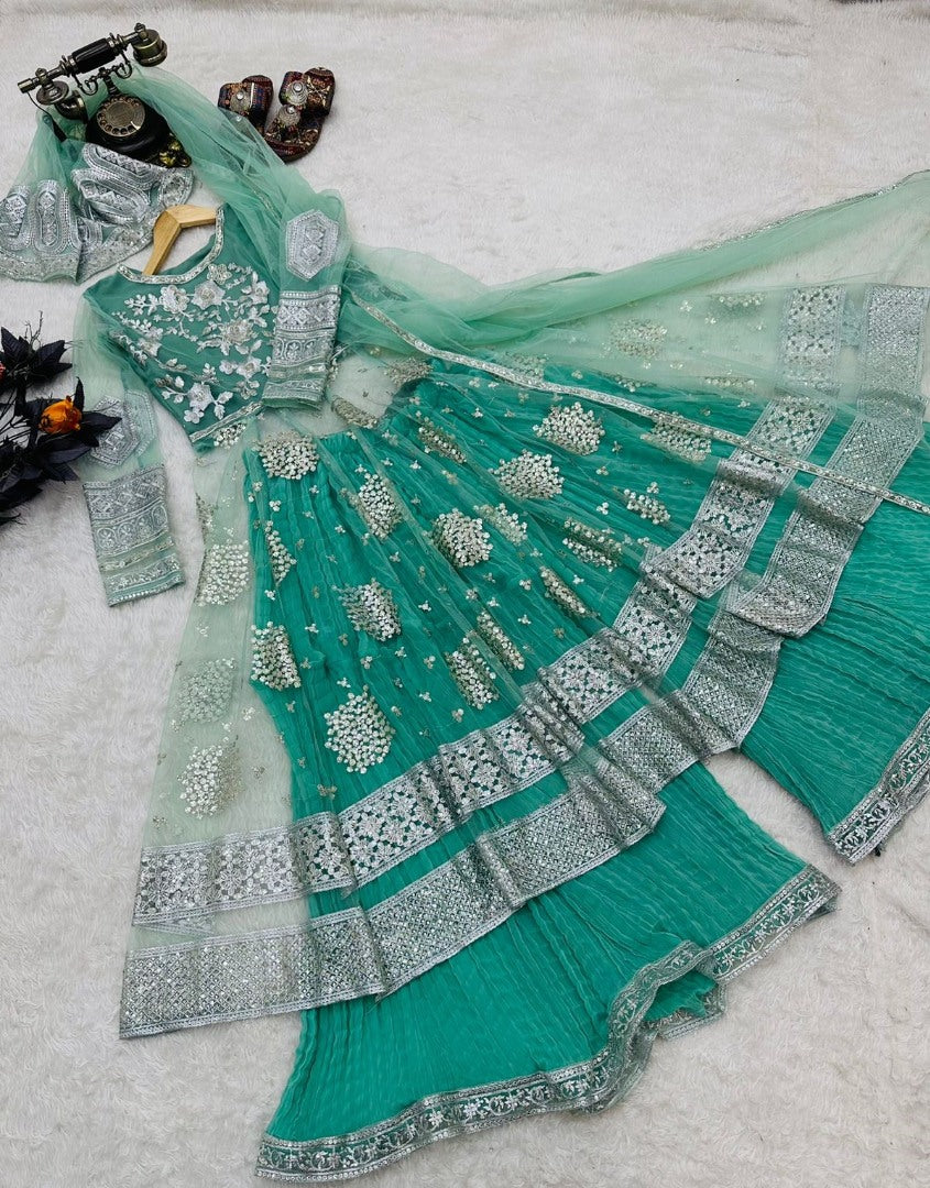 Pista green soft net embroidery worked wedding sharara suit