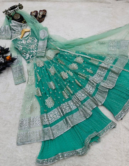 Pista green soft net embroidery worked wedding sharara suit