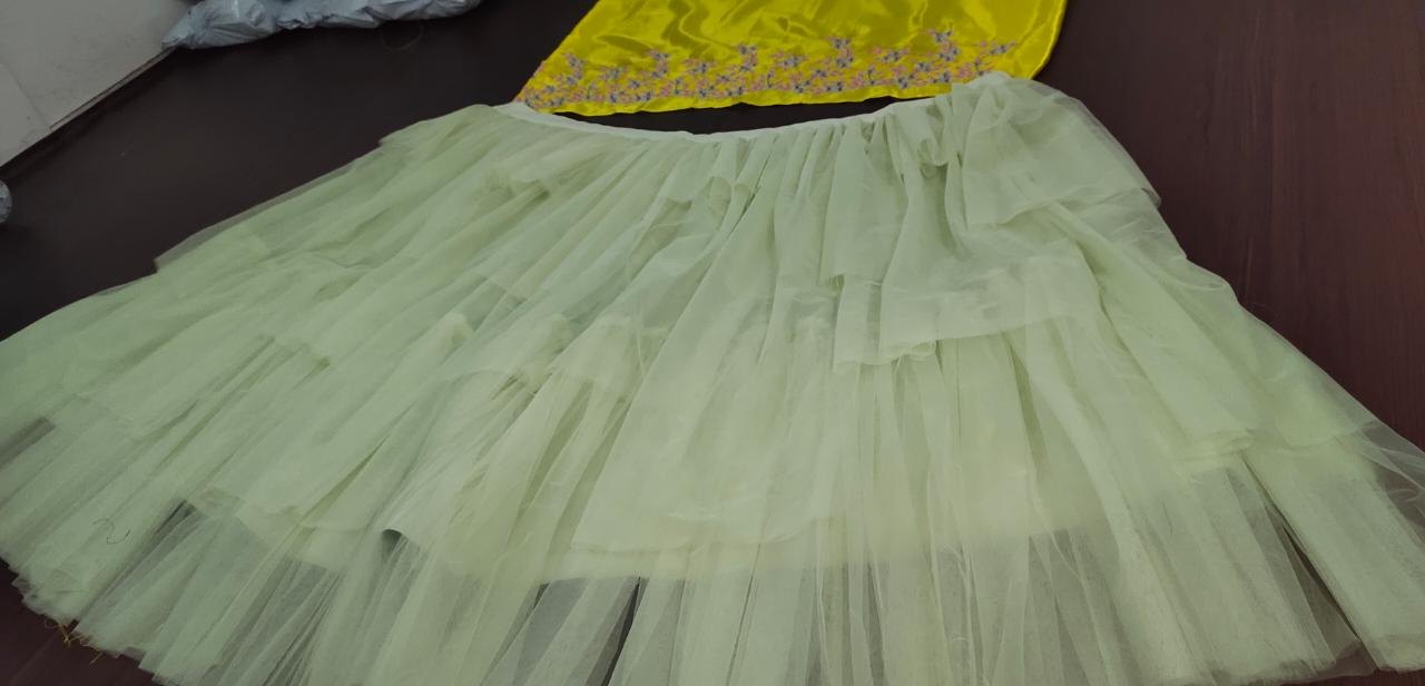 Pista green soft net multi layer lehenga with embroidered crop top
