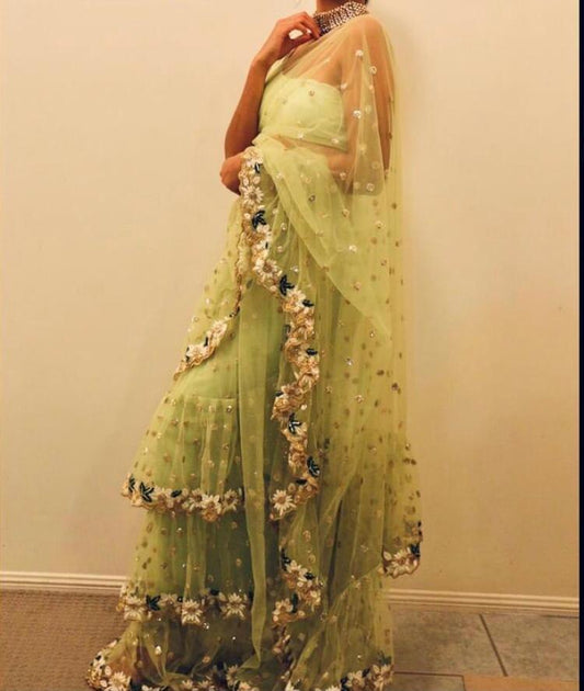 Pista green soft net sequence and thread work ruffle saree