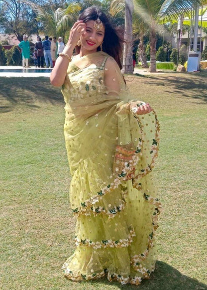 Pista green soft net sequence and thread work ruffle saree