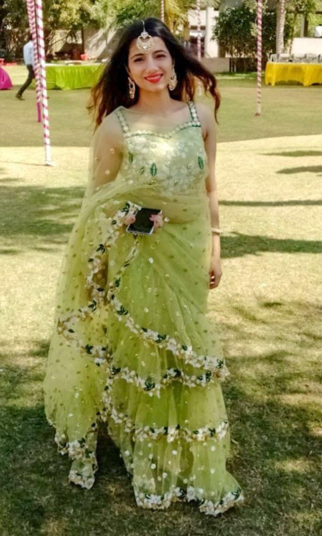 Pista green soft net sequence and thread work ruffle saree