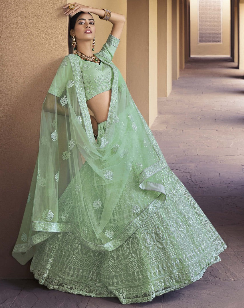 Pista green soft net sequence work bridal lehenga choli