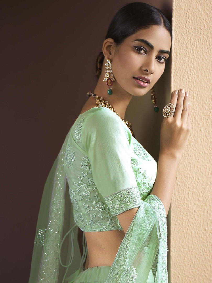 Pista green soft net sequence work bridal lehenga choli