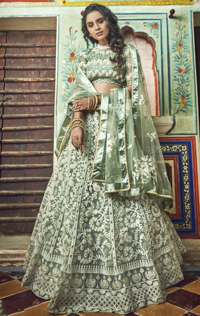 Pista green soft net thread and pearl work bridal lehenga choli