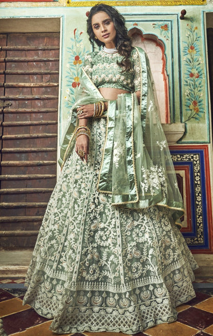 Pista green soft net thread and pearl work bridal lehenga choli