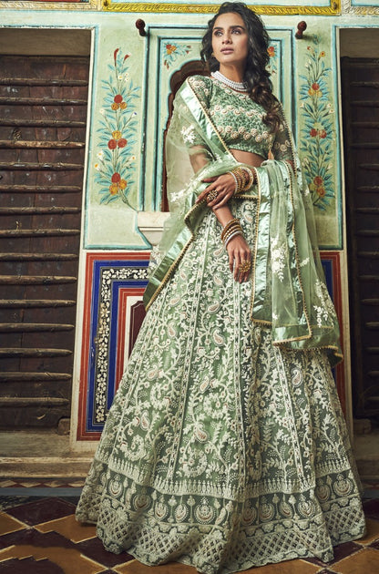 Pista green soft net thread and pearl work bridal lehenga choli