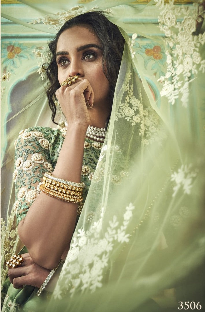 Pista green soft net thread and pearl work bridal lehenga choli