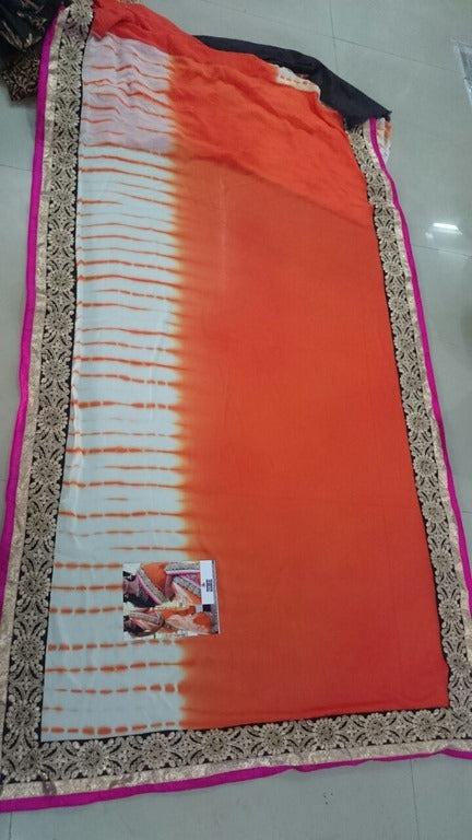 pretty look orange lace border saree with fancy blouse