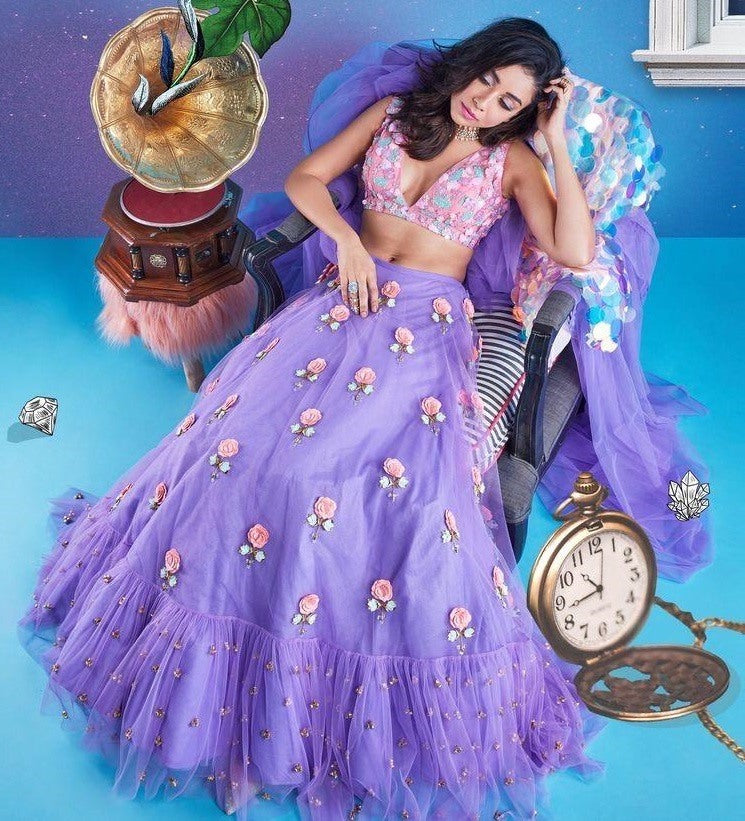 purple net flower patch and thredworked lehenga choli for ceremony