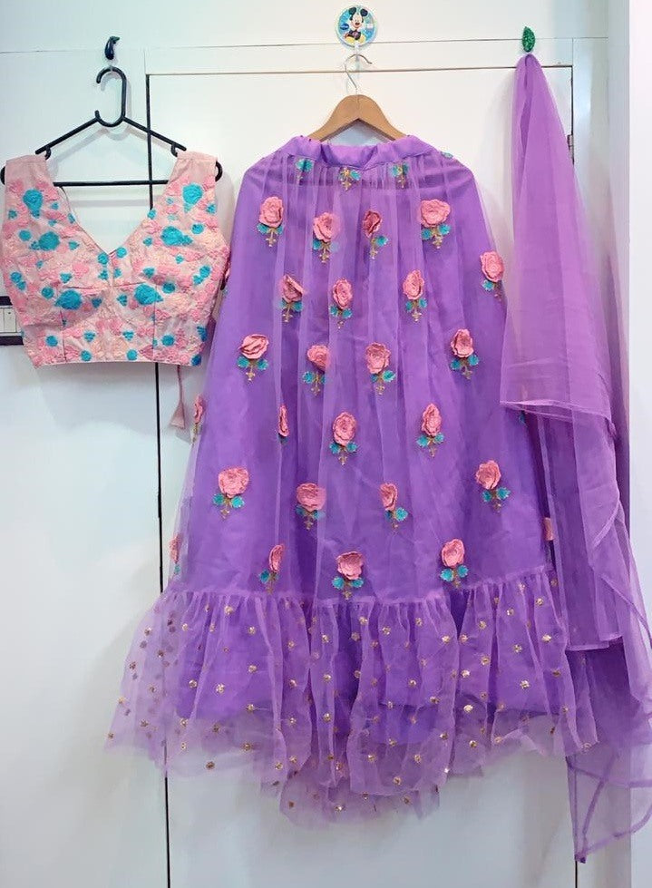 purple net flower patch and thredworked lehenga choli for ceremony