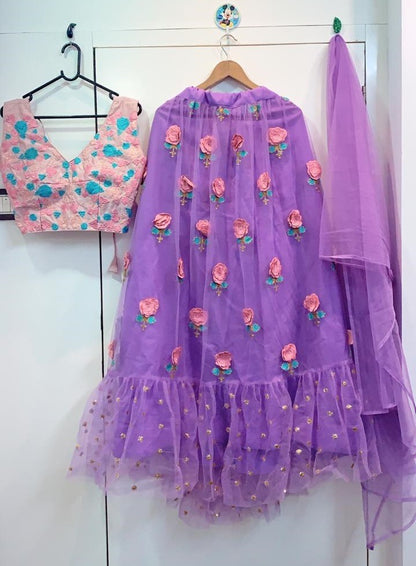 purple net flower patch and thredworked lehenga choli for ceremony