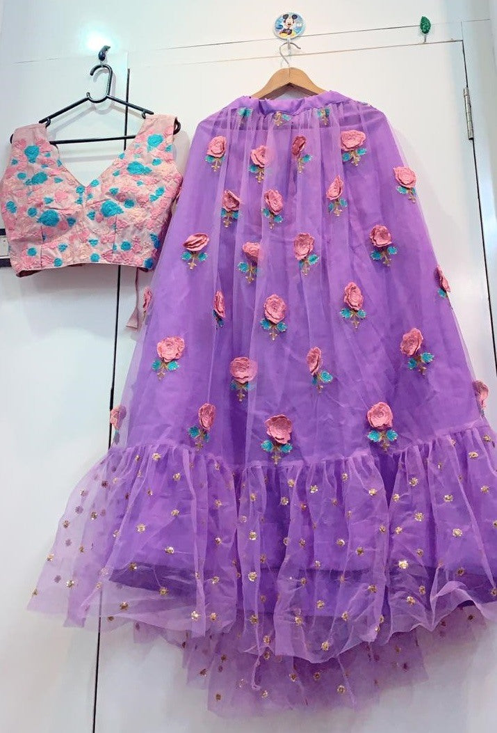 purple net flower patch and thredworked lehenga choli for ceremony