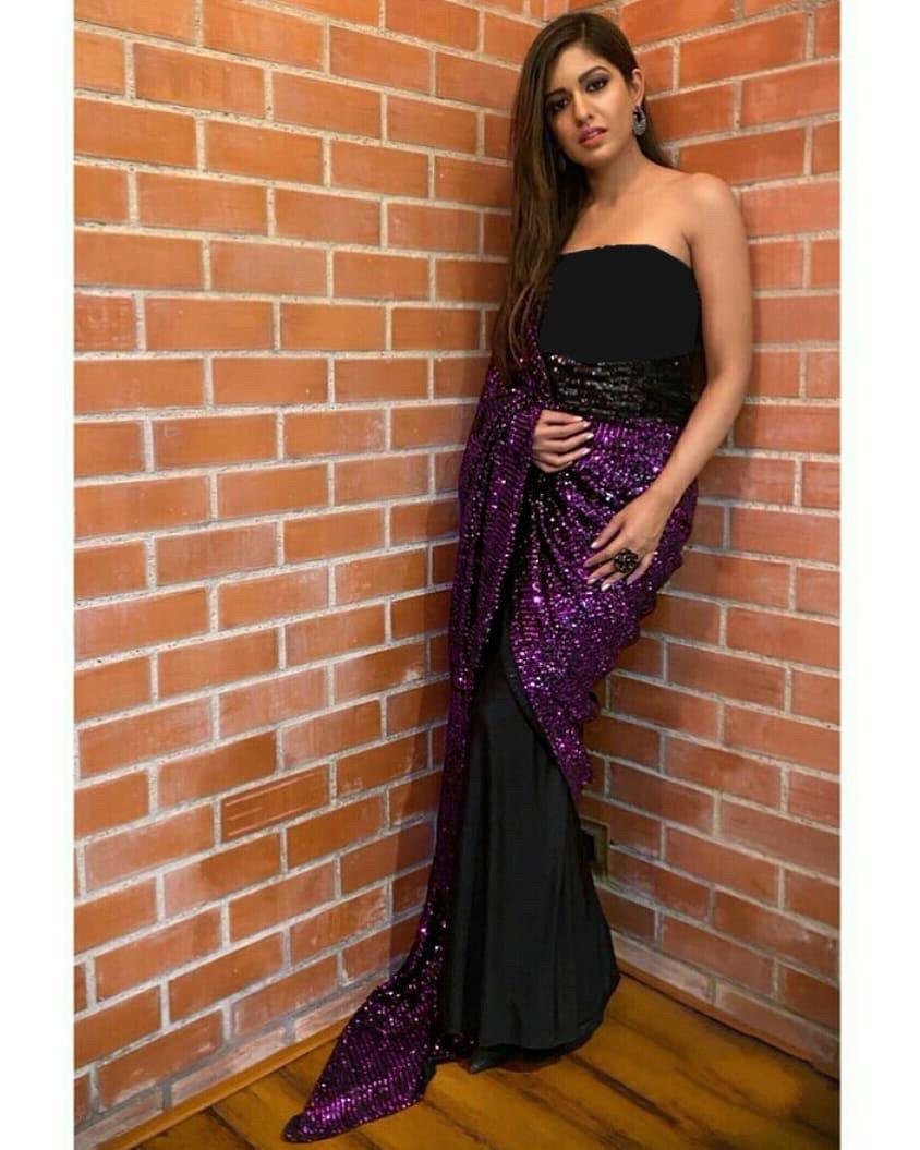 Purple sequence work and black half half glamorous saree