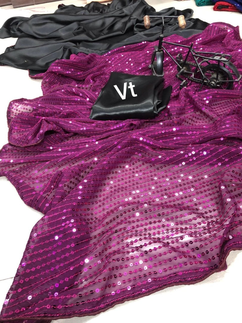 Purple sequence work and black half half glamorous saree