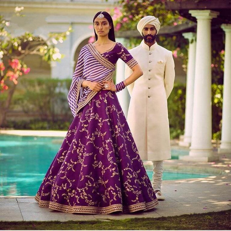 purple tapeta silk heavy embroidered wedding lehenga