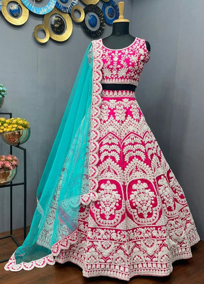 Rani pink tapeta silk heavy embroidered bridal lehenga choli