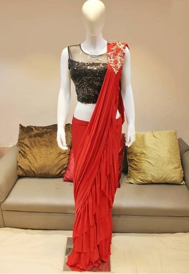 Red georgette glamorous partywear saree with black sequence work blouse