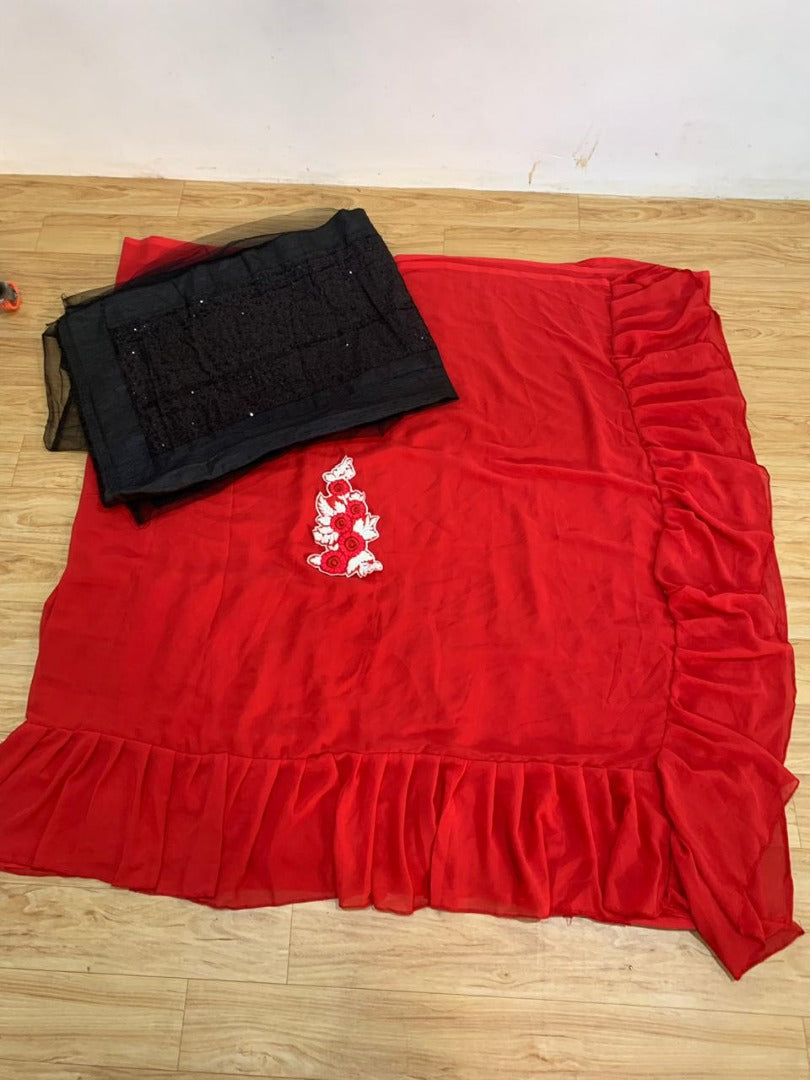 Red georgette glamorous partywear saree with black sequence work blouse