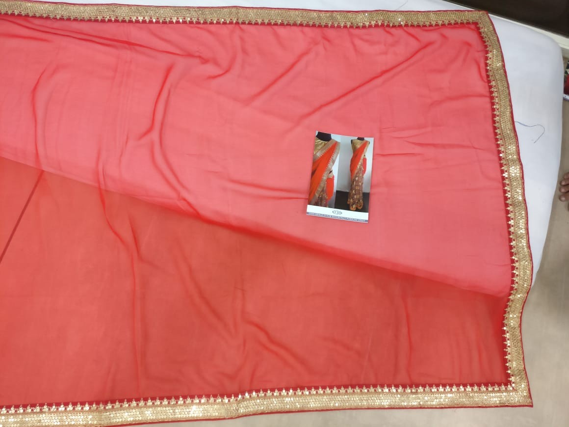 Red georgette pallu and net scut embroidered partywear saree