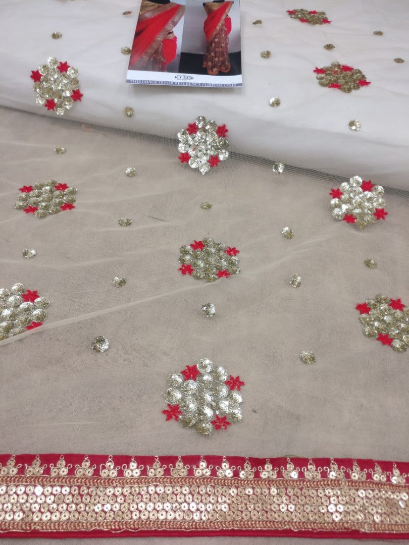 Red georgette pallu and net scut embroidered partywear saree