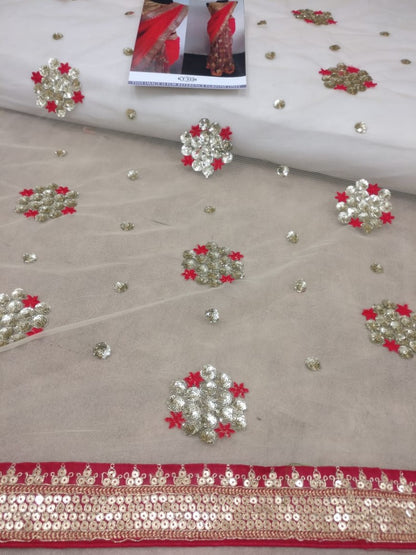 Red georgette pallu and net scut embroidered partywear saree