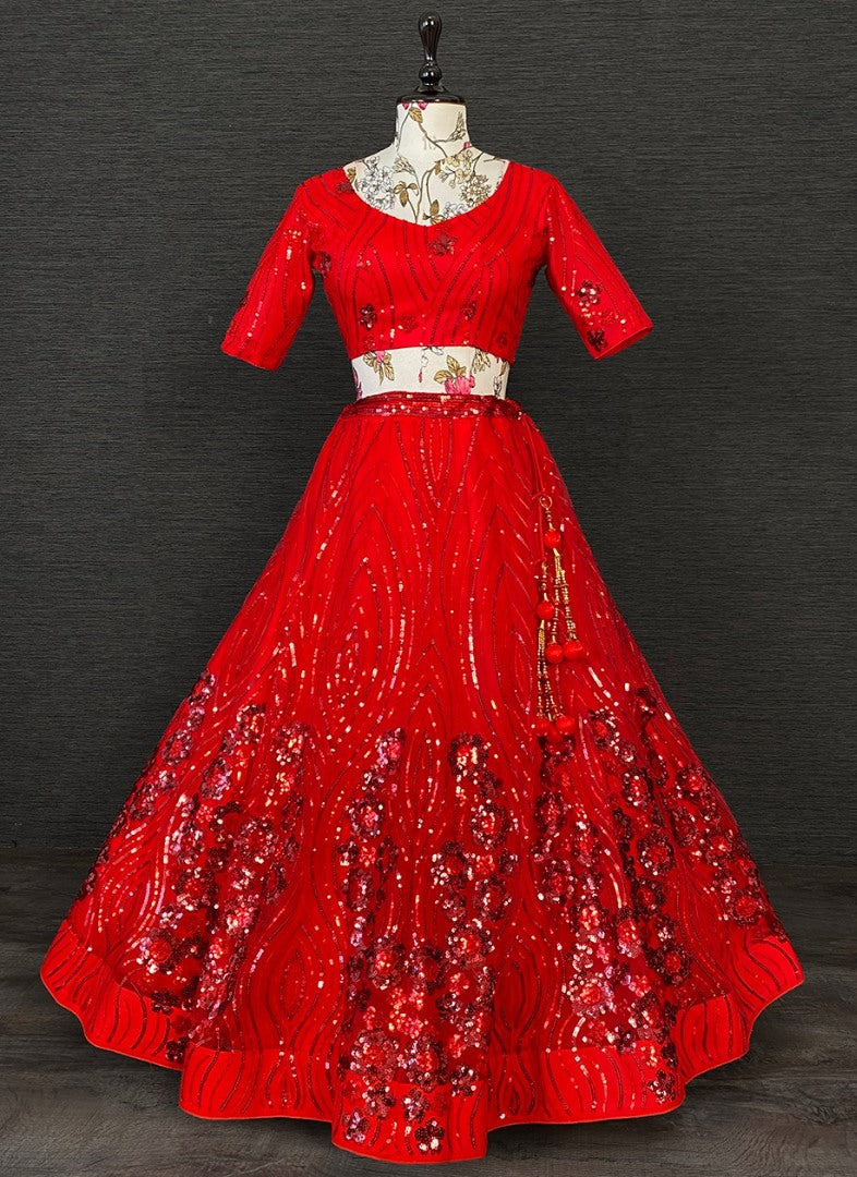 Red net heavy sequence embroidered wedding lehenga choli