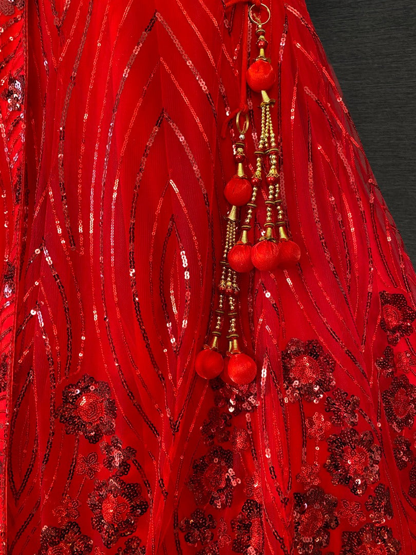 Red net heavy sequence embroidered wedding lehenga choli