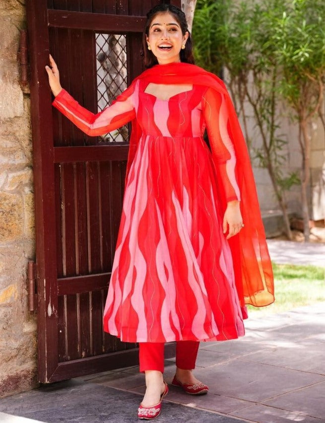 Red organza silk print and ribbon work anarkali suit