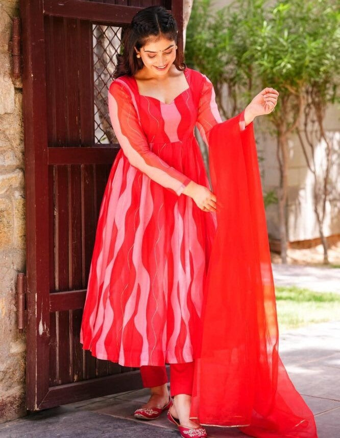 Red organza silk print and ribbon work anarkali suit