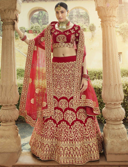 Red pure velvet stone and zari work bridal lehenga choli