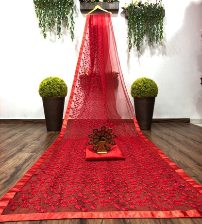 Red soft net heavy embroidered saree