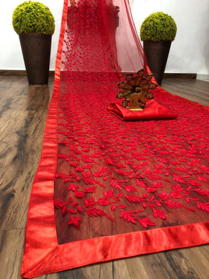 Red soft net heavy embroidered saree