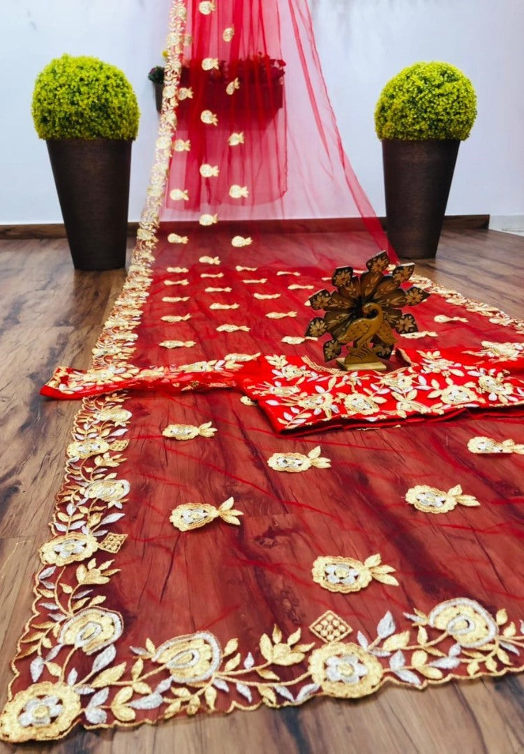 Red soft net thread work saree