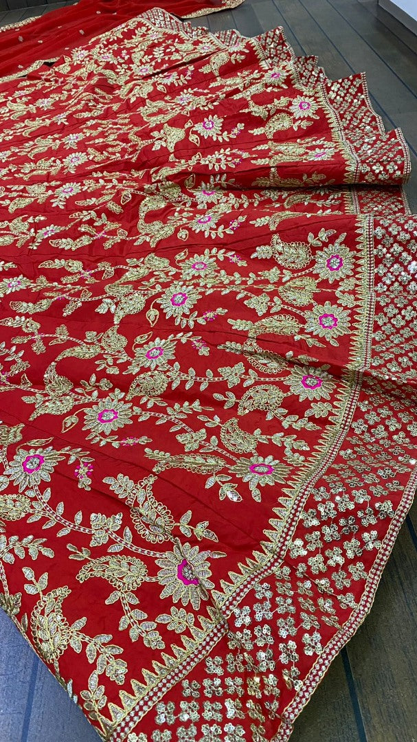 Red tapeta silk heavy sequence and thread embroidered wedding lehenga choli