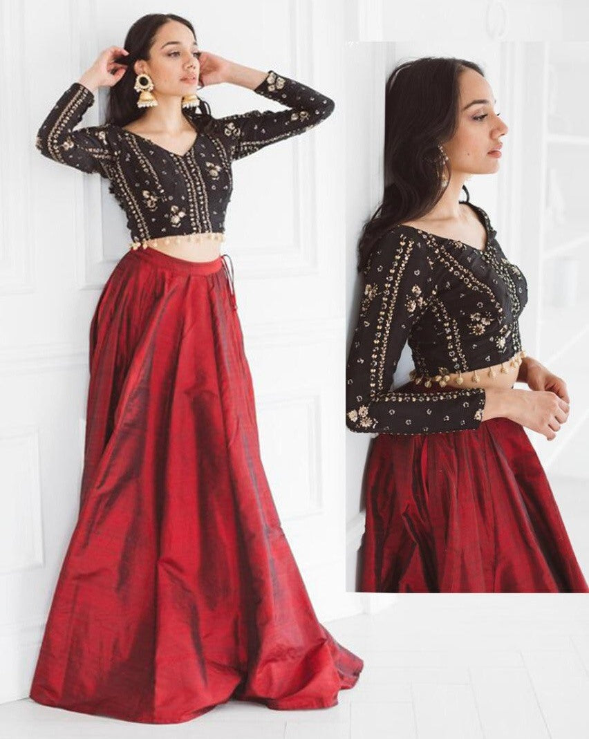 Red tapeta silk partywear lehenga with embroidered blouse