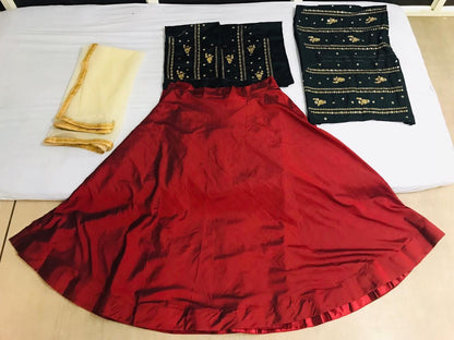 Red tapeta silk partywear lehenga with embroidered blouse