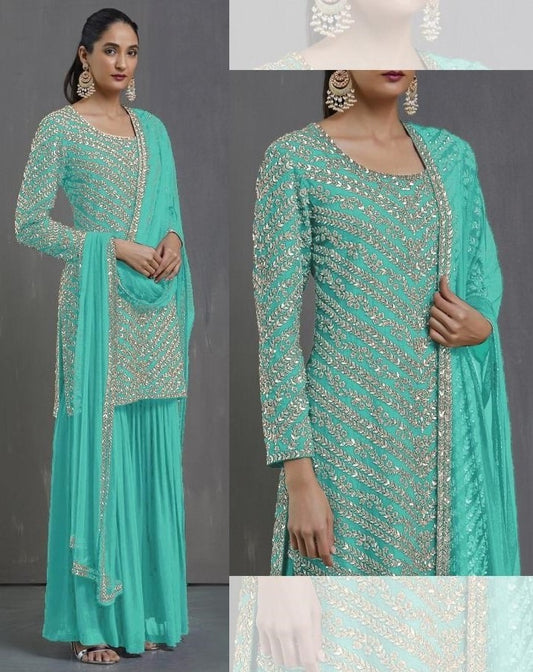 Sea green faux georgette embroidered sequence plazzo suit